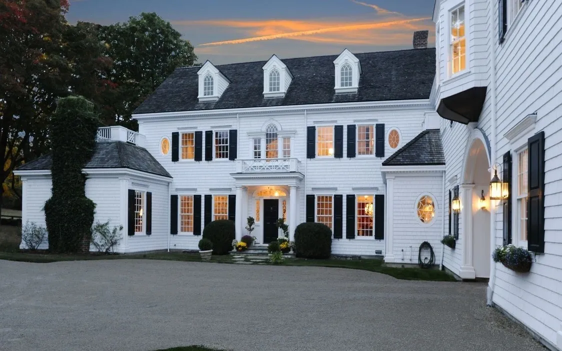 Two-story white house with dormer windows