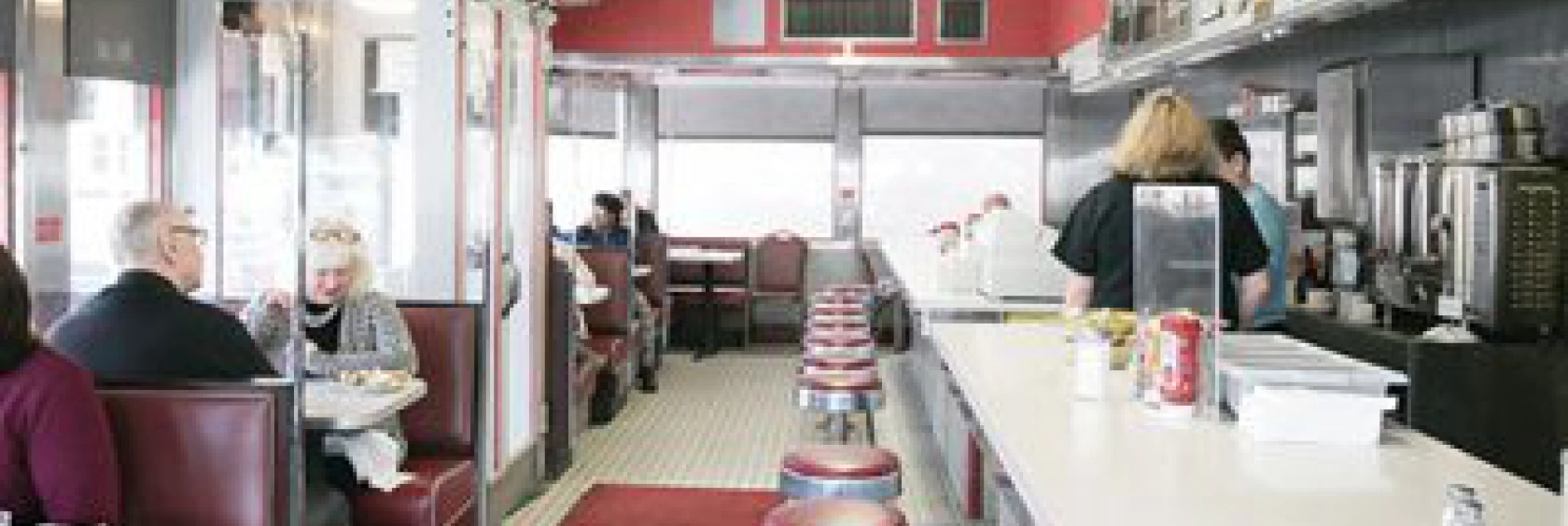 People dining in vintage-style diner