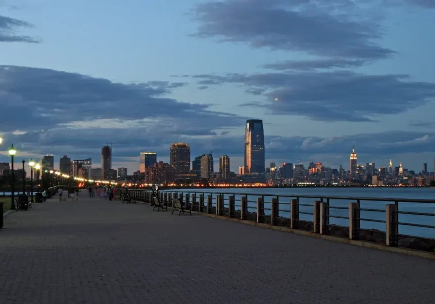 City skyline at dusk with promenade