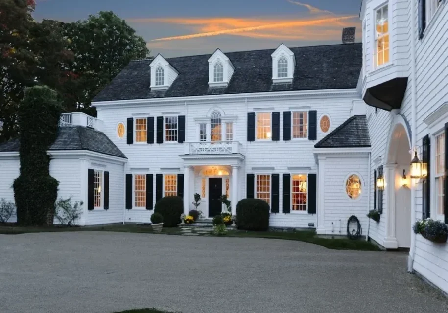 Two-story white house with dormer windows